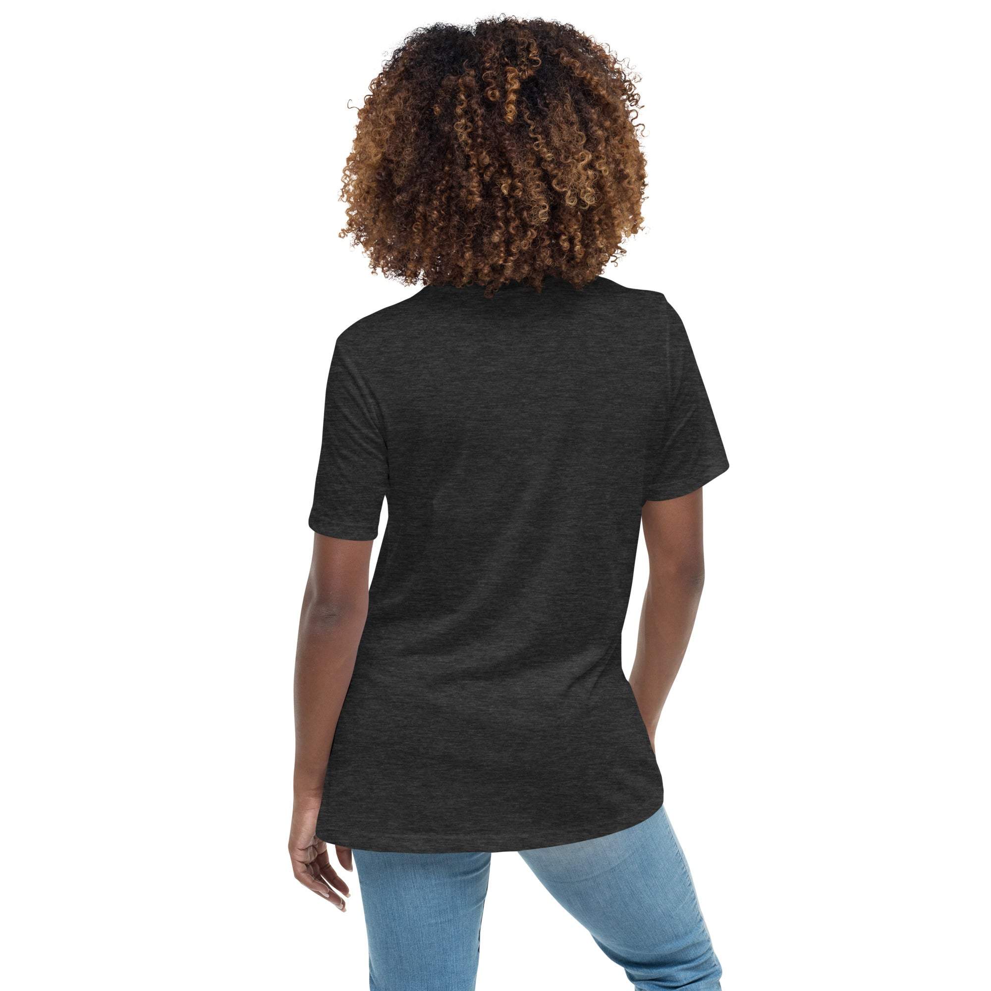 Back view of a woman wearing a black Keep Climbing women's t-shirt with a fitted cut and short sleeves paired with blue jeans