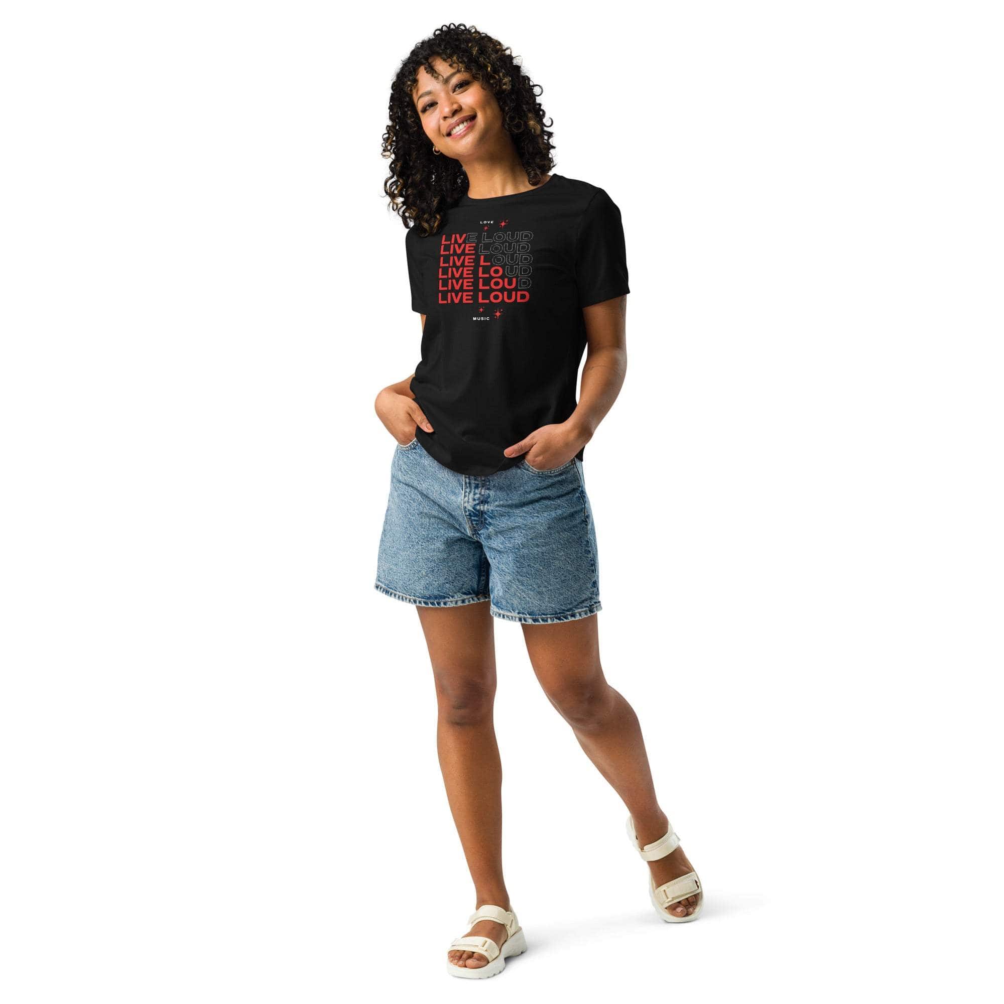 Woman wearing black LIVE LOUD Music T-Shirt with bold retro typography and denim shorts