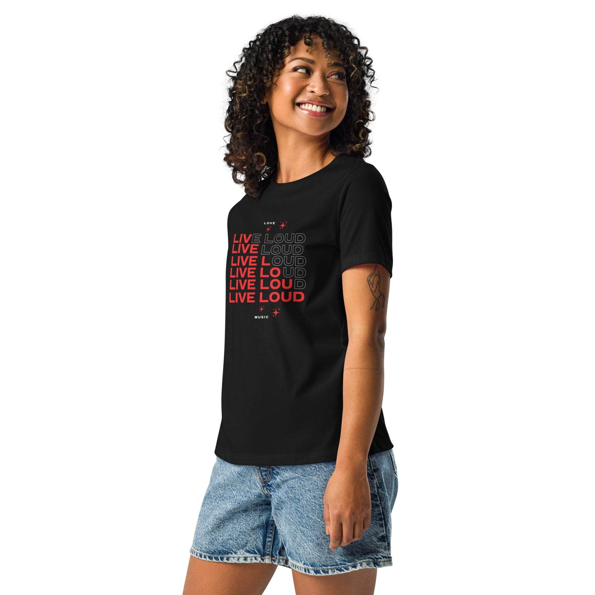 Woman wearing black LIVE LOUD Music T-Shirt with bold retro typography and graphic print paired with denim shorts
