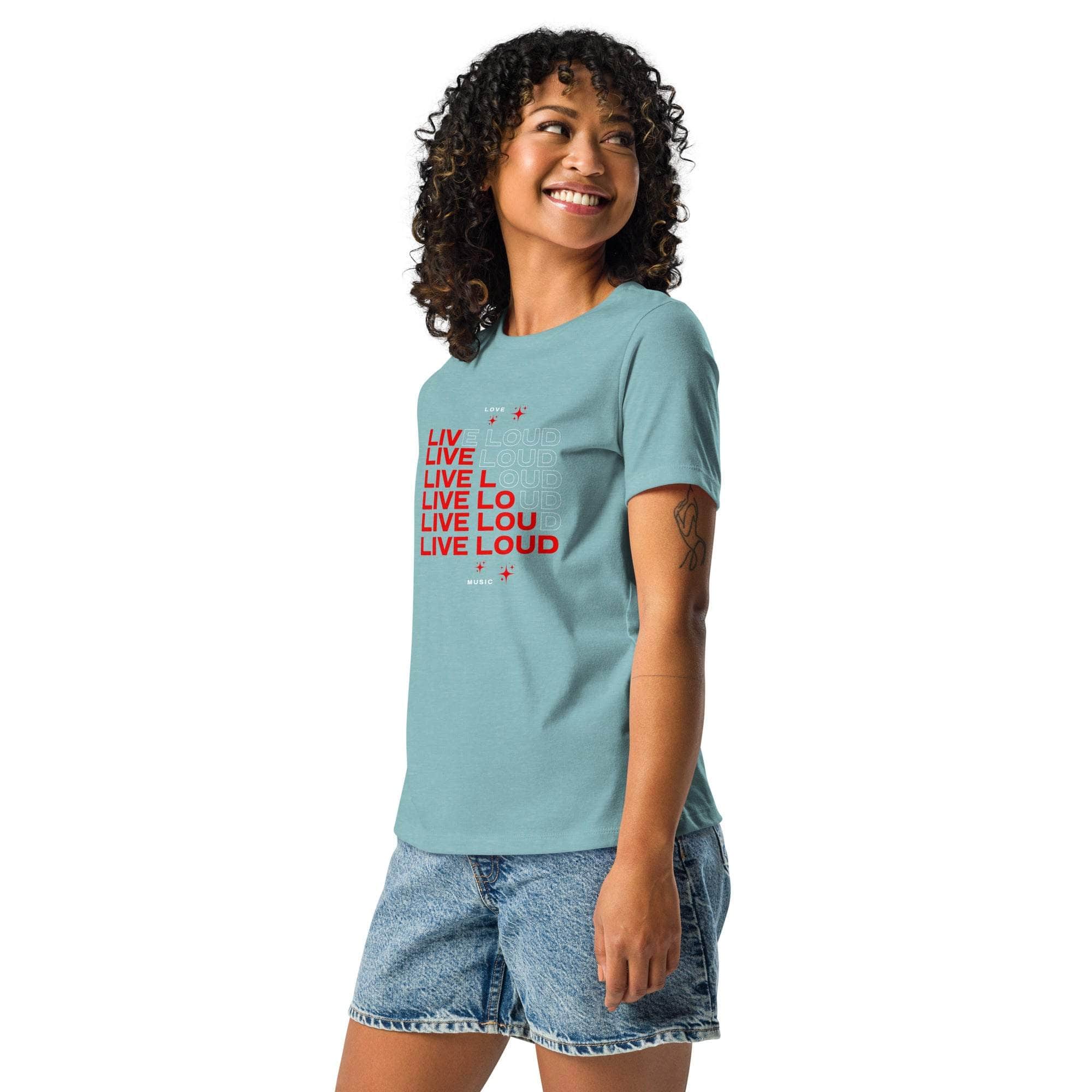 LIVE LOUD Music T-Shirt in teal with bold red retro typography worn by smiling woman in denim shorts
