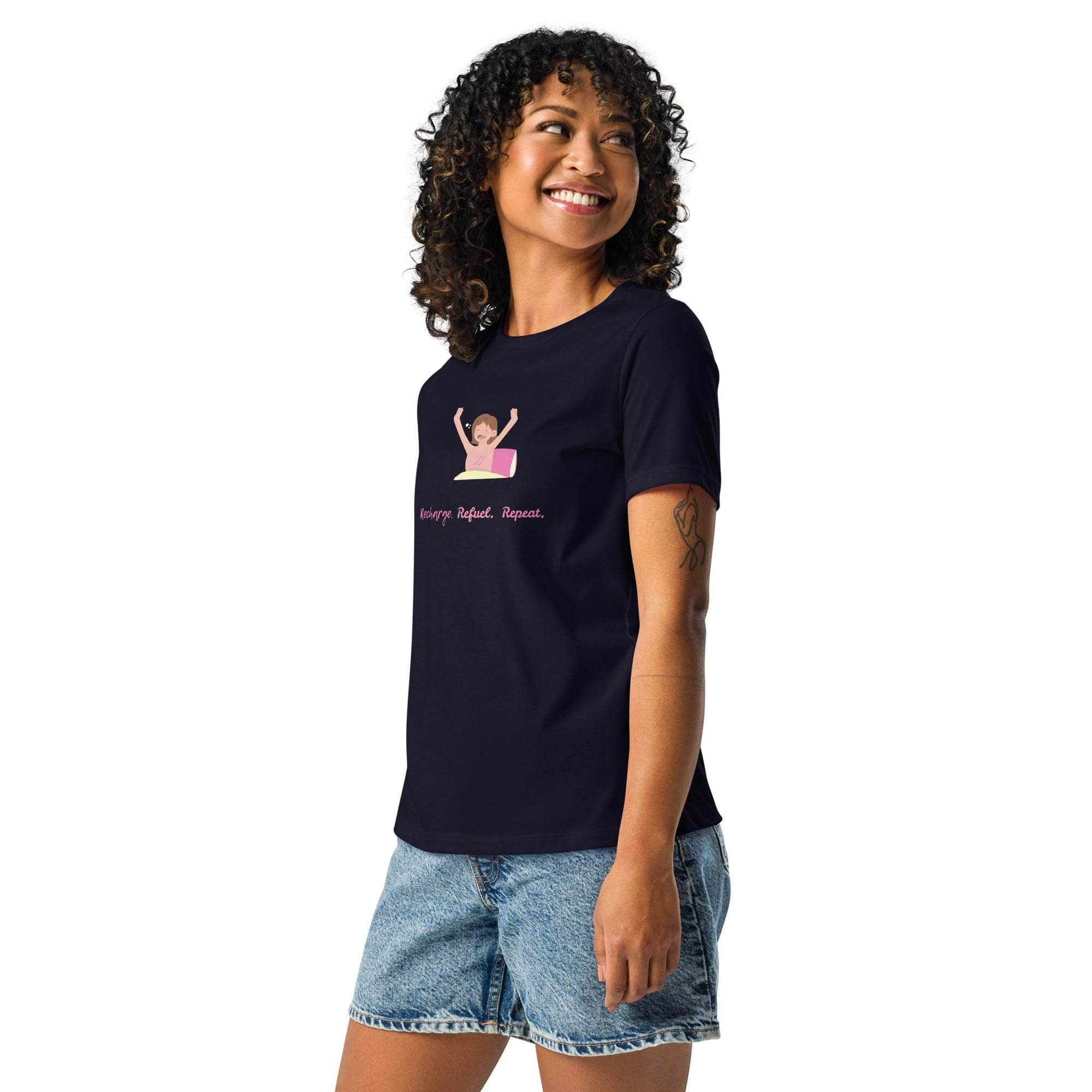 Woman wearing a navy blue Science Repeat Apparel T-Shirt with a colorful science-themed design and text, paired with denim shorts.