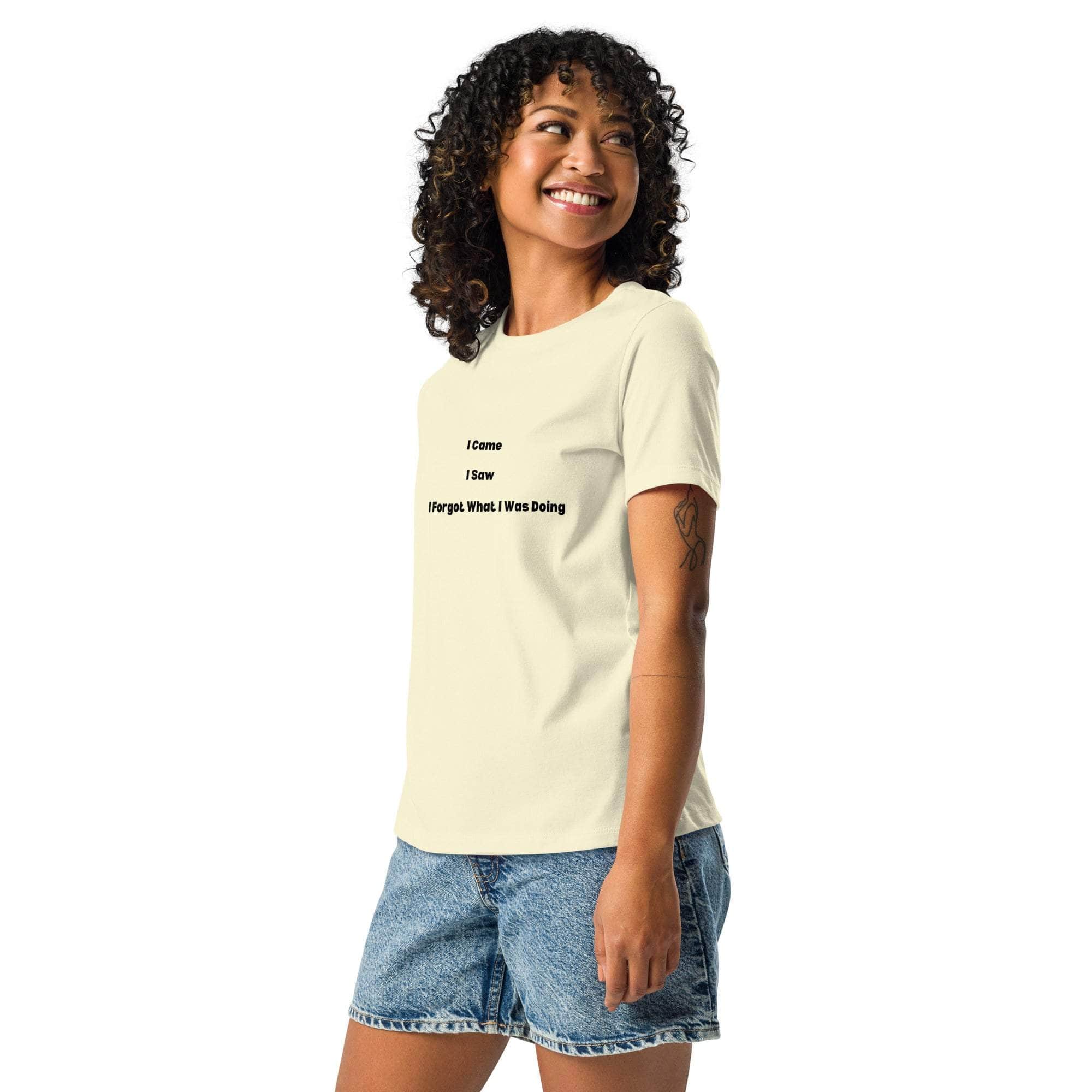 Woman wearing a beige "I Came I Saw I Forgot What I Was Doing" sarcastic t-shirt with denim shorts, smiling and posing sideways.