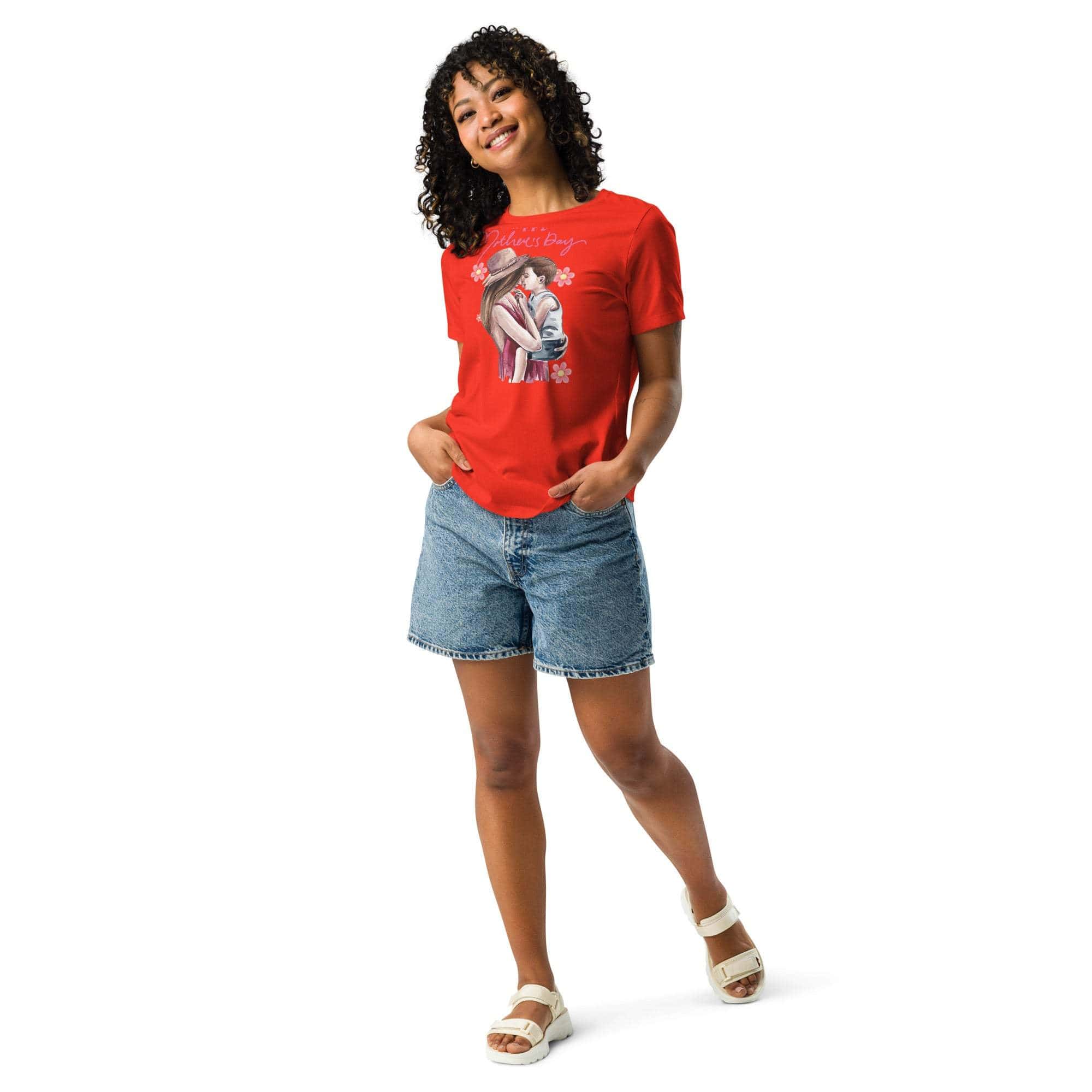 Woman wearing a red Mother's Day T-shirt with a mom and child graphic paired with denim shorts and white sandals