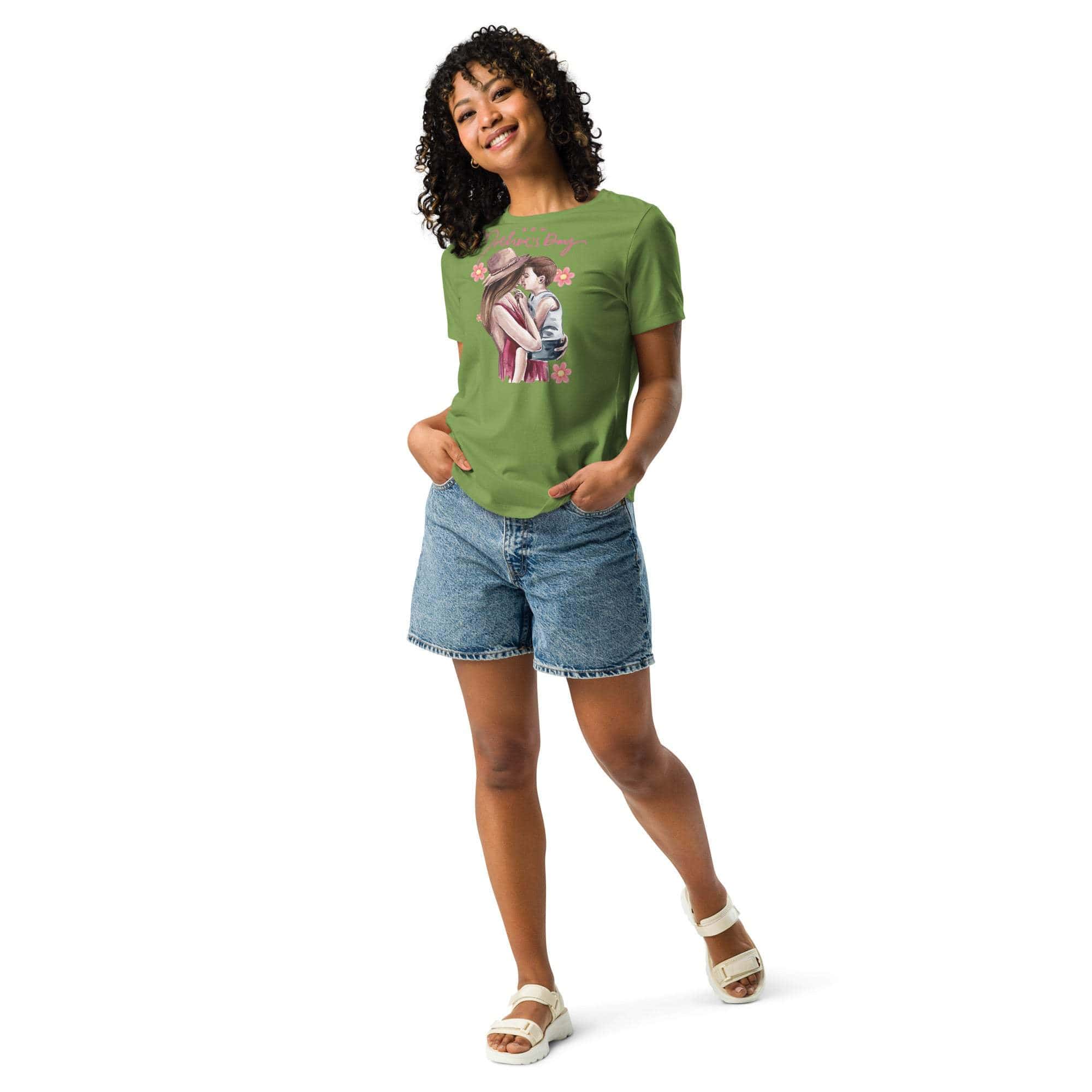 Woman wearing green Mother's Day T-shirt with mom and child graphic paired with denim shorts and white sandals