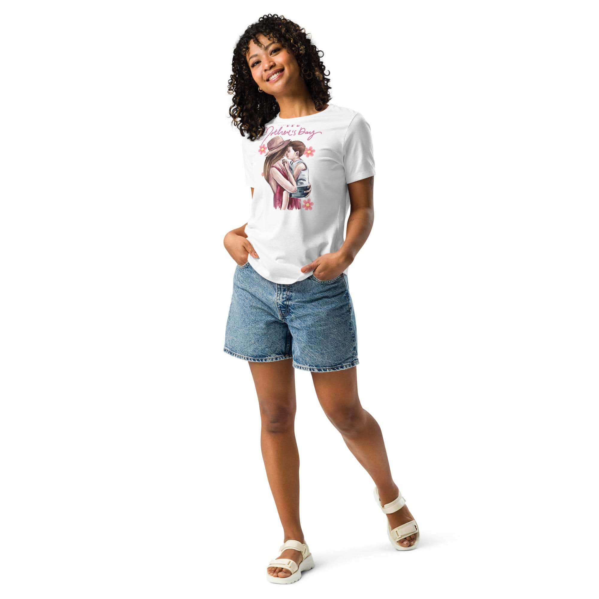 Woman wearing a white Mothers Day T-shirt with mom and child graphic paired with denim shorts and white sandals
