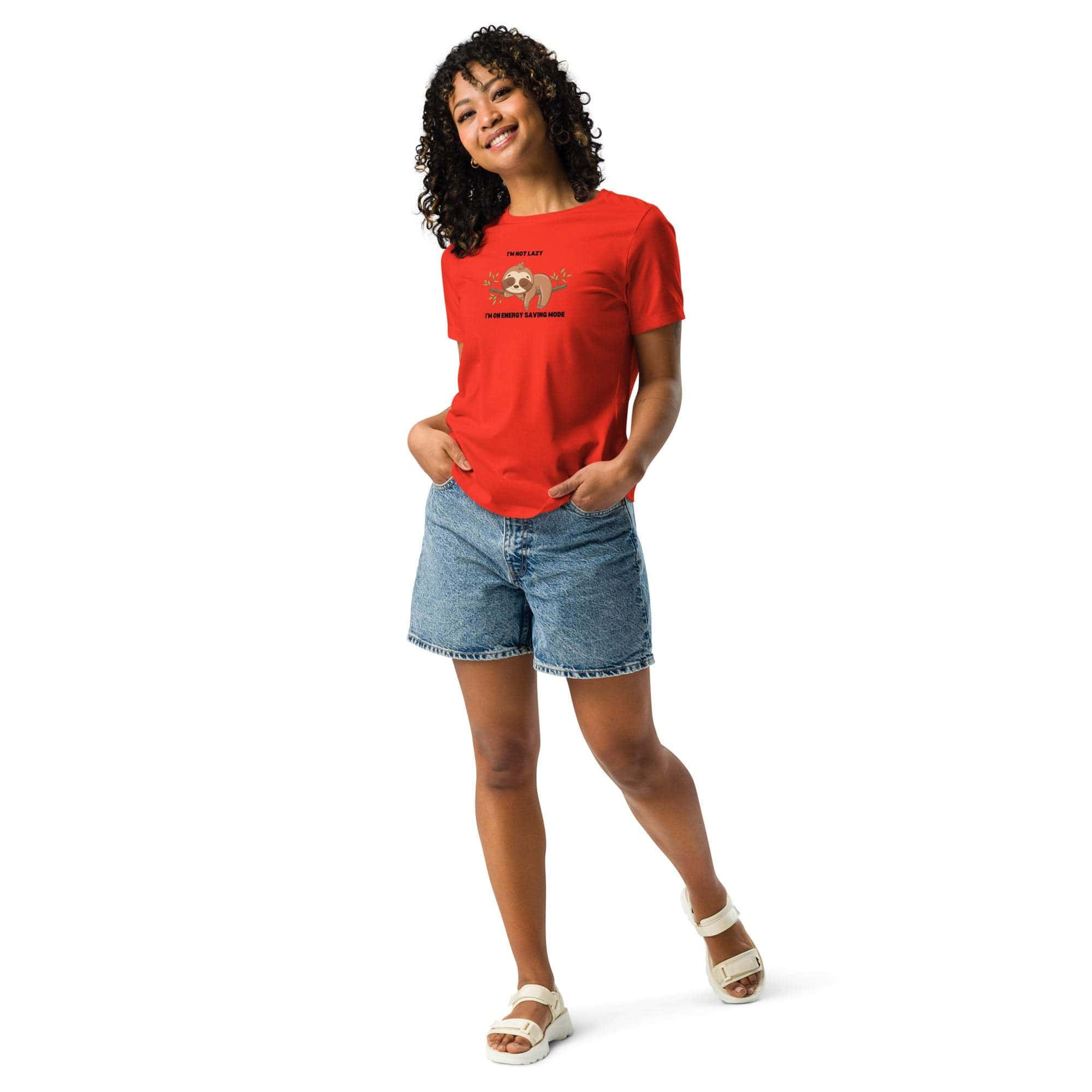 Woman wearing red "I'm Not Lazy, I am On Energy Saving Mode" sloth T-shirt with denim shorts and white sandals