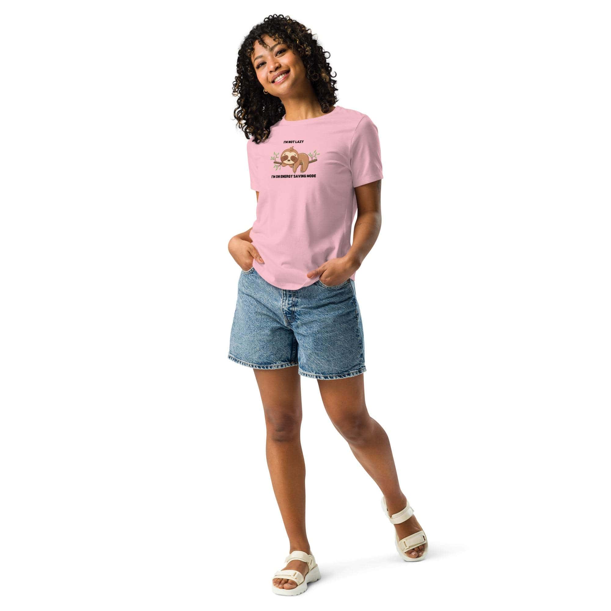 Woman wearing pink "I'm Not Lazy" sloth graphic t-shirt with denim shorts and white sandals