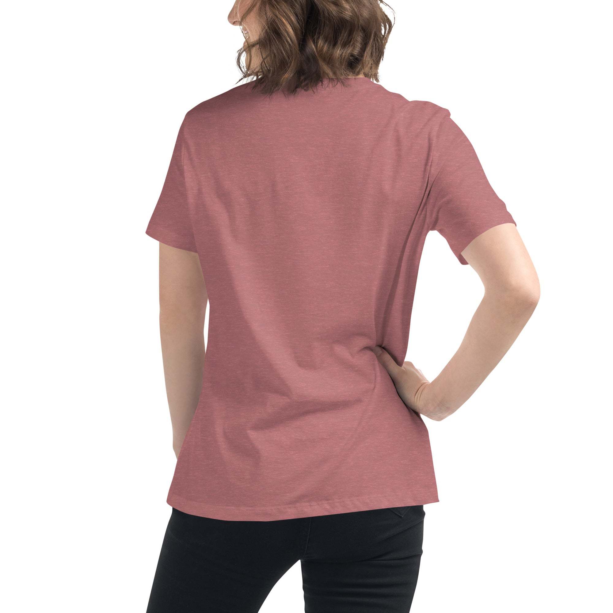 Back view of a person wearing a rose-colored minimalist speechless face line art t-shirt with short sleeves and black pants
