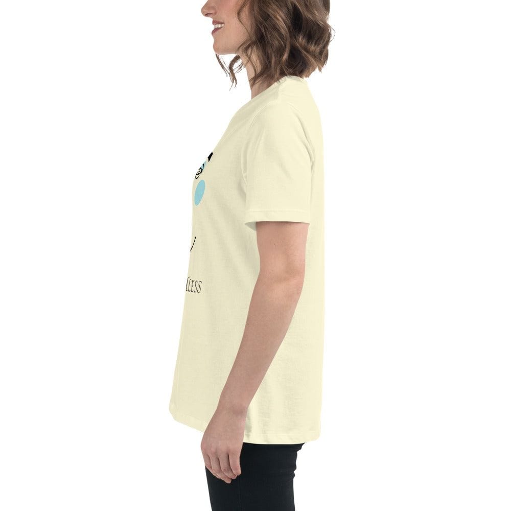 Side view of a woman wearing a beige minimalist speechless face line art t-shirt with short sleeves and black pants