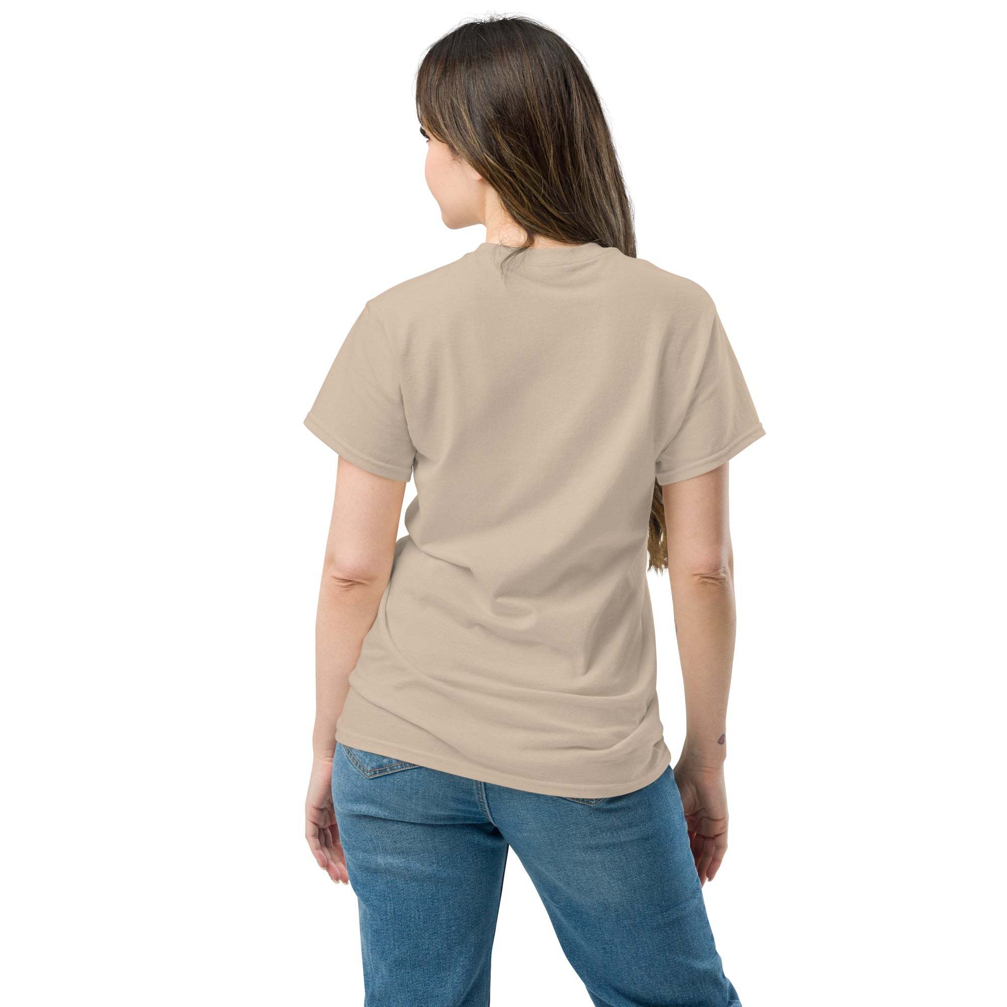 Woman wearing beige Christian Cross T-Shirt showing back view with blue jeans on white background