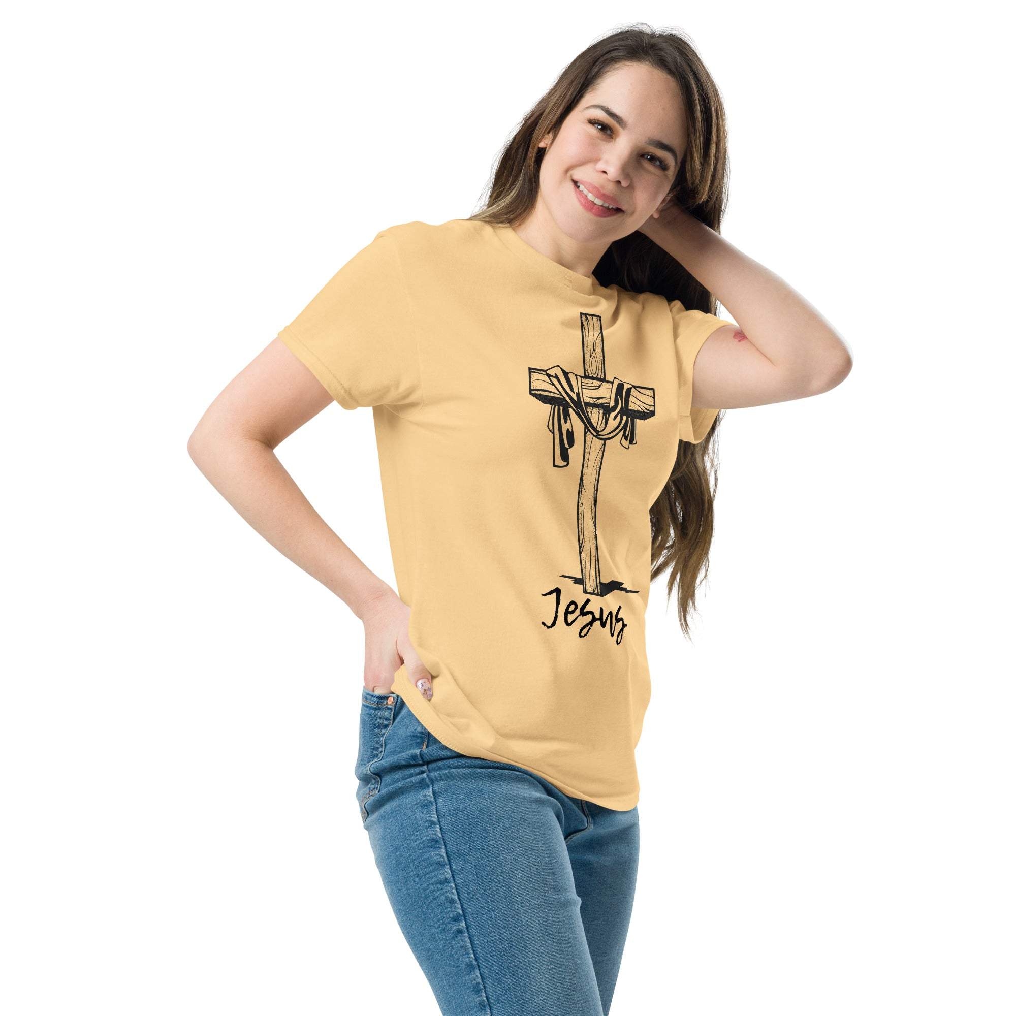 Woman wearing beige Christian Cross T-Shirt with Jesus graphic and blue jeans