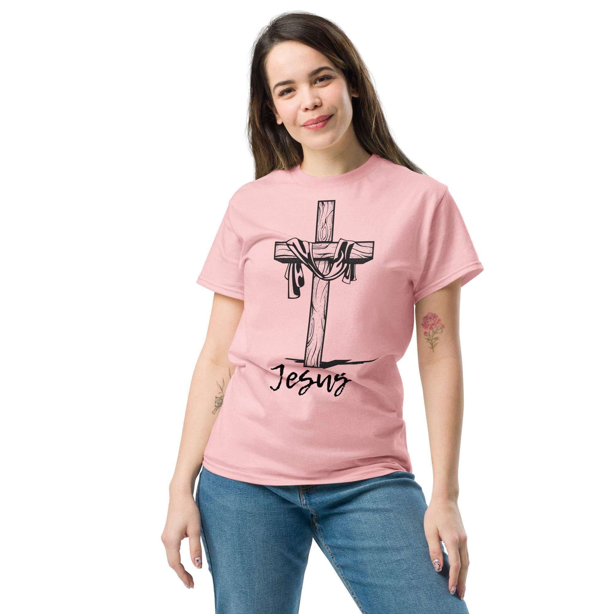 Woman wearing pink Christian Cross T-Shirt with Jesus graphic and inspirational Bible verse design