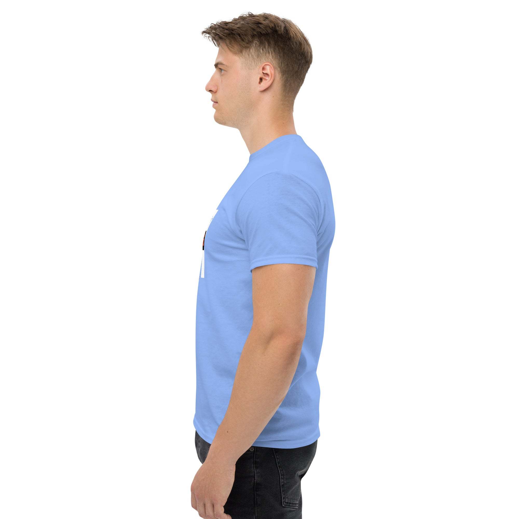 Side view of a man wearing a light blue trendy graphic t-shirt with motivational print and black pants