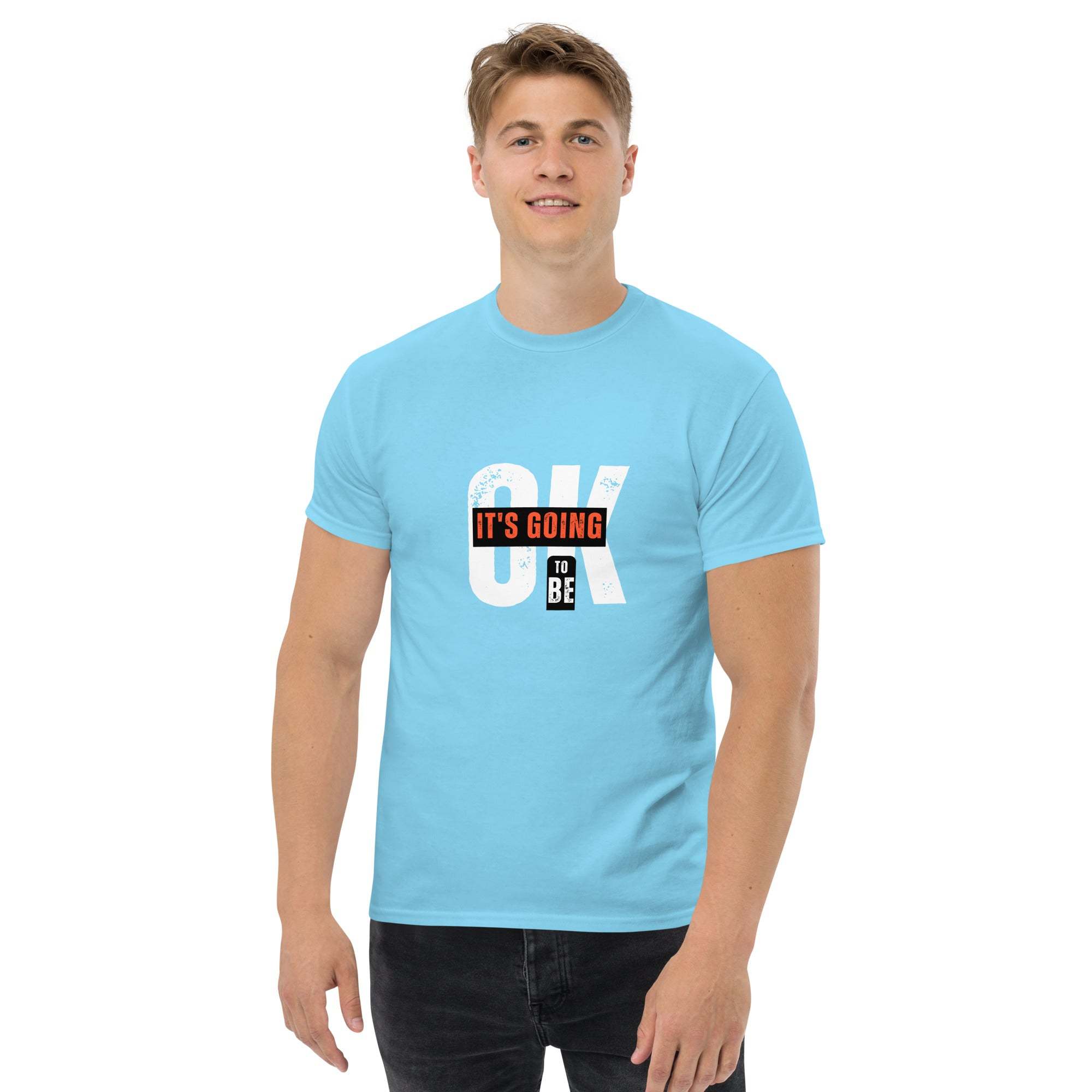 Light blue trendy graphic t-shirt with motivational "OK It's Going To Be" print worn by man