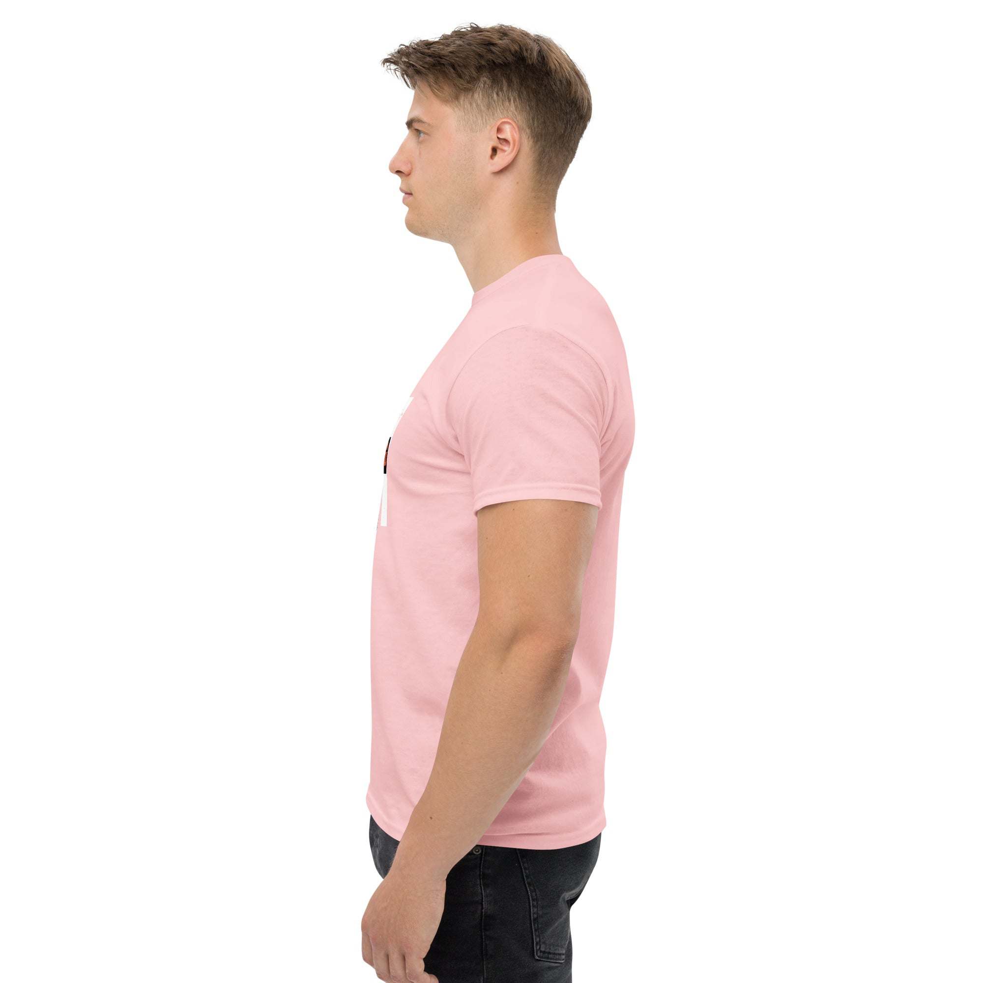 Side view of man wearing pink trendy graphic t-shirt with motivational quote, casual summer streetwear style