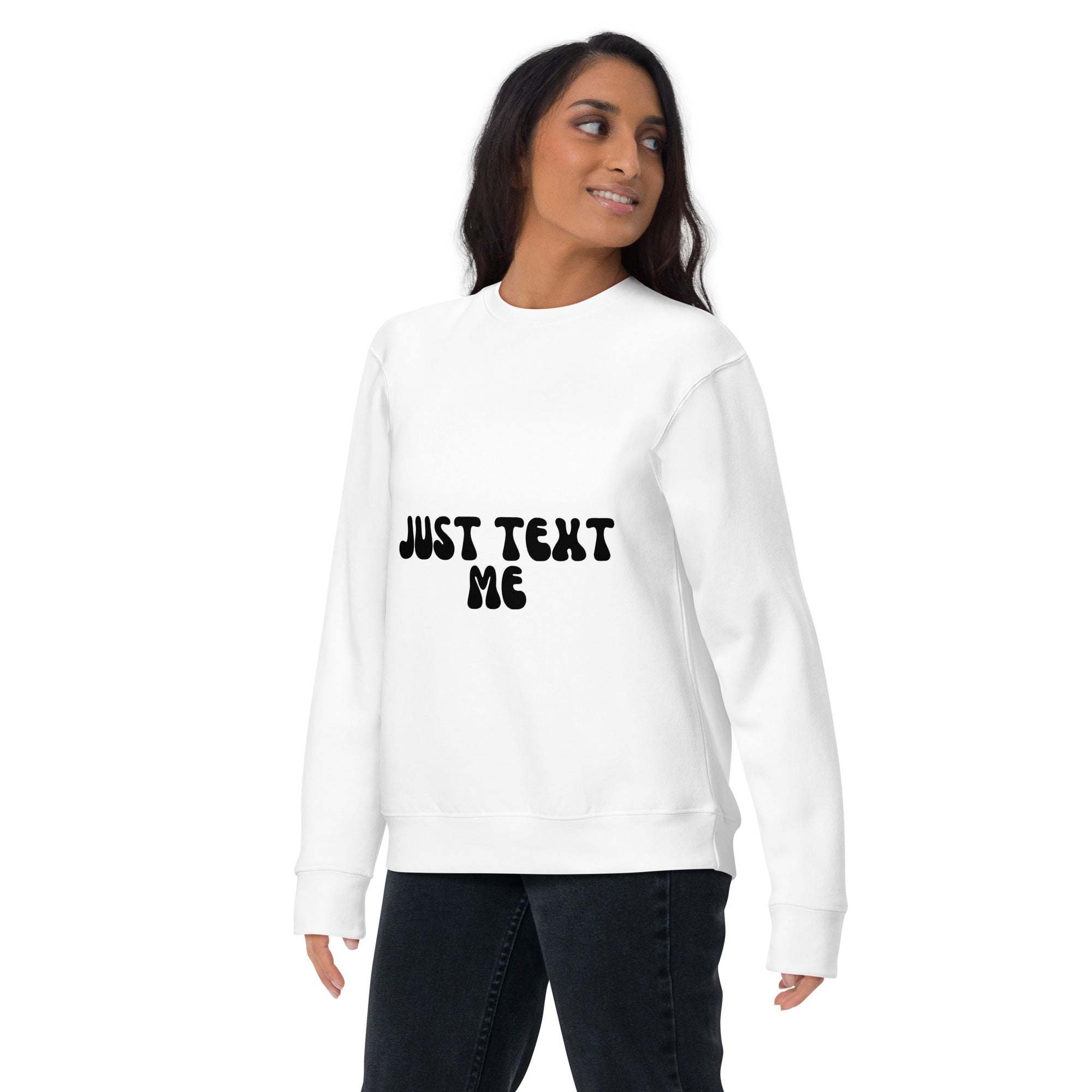 Woman wearing white Just Text Me sweatshirt with black text and casual jeans
