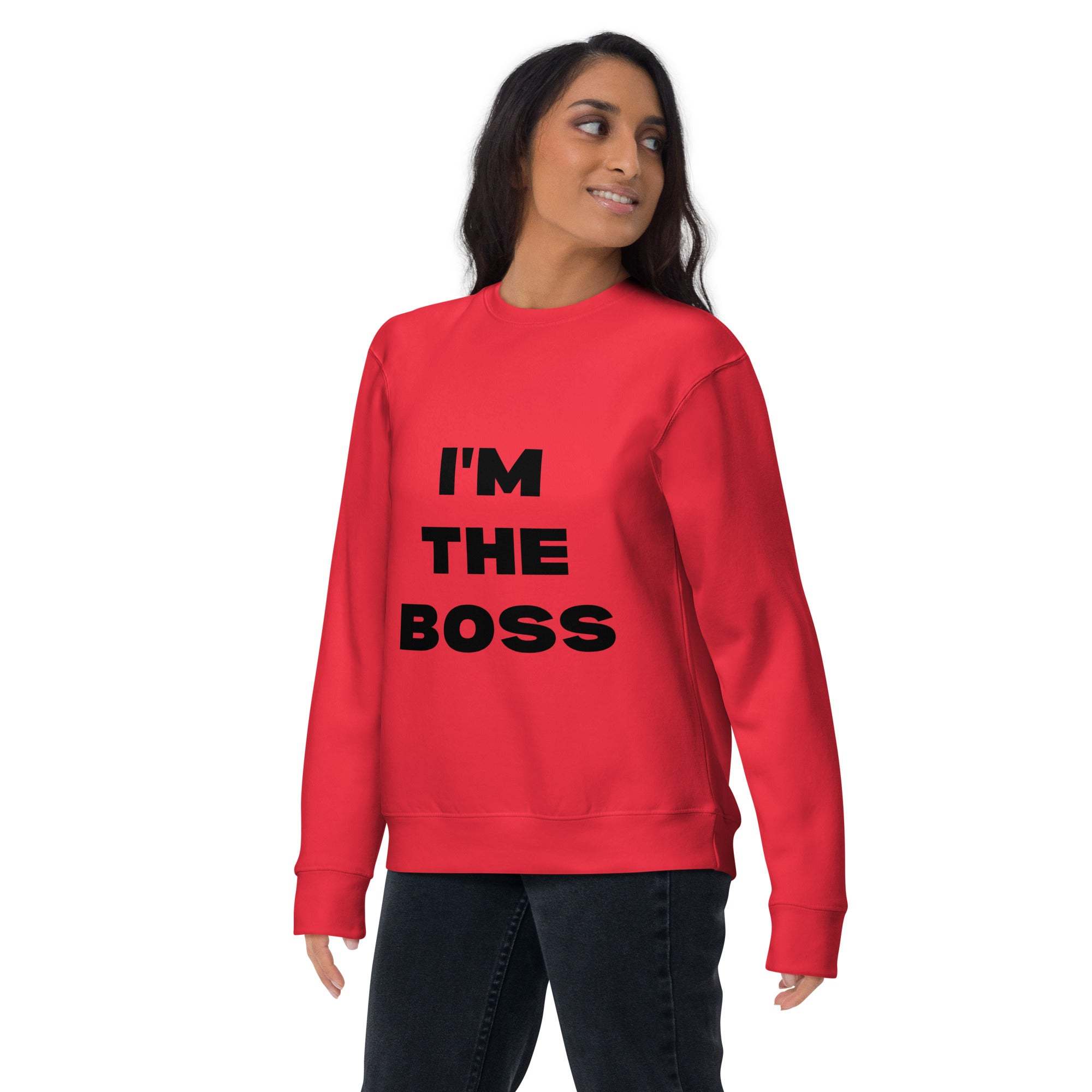 Woman wearing red "I'm The Boss" sweatshirt with black bold text, casual and confident style