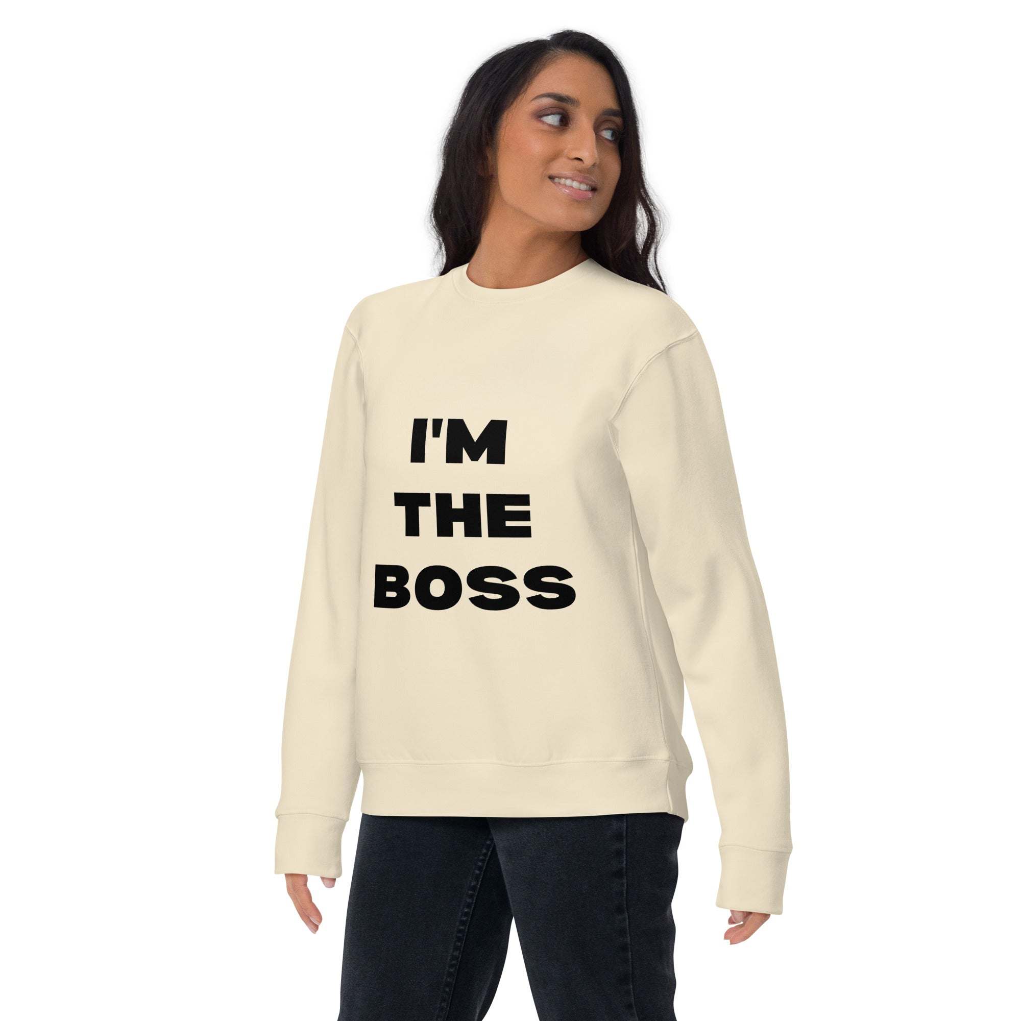 Woman wearing cream "I'm The Boss" sweatshirt with bold black text, casual and comfortable crewneck pullover.