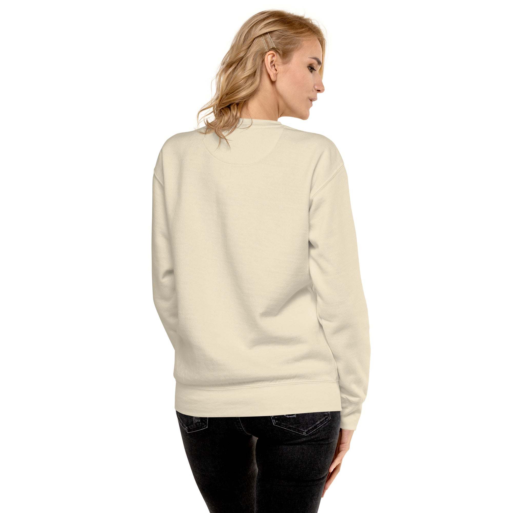 Woman wearing a beige Positive Sun Sweatshirt viewed from the back, showcasing its unisex crewneck design and comfortable fit
