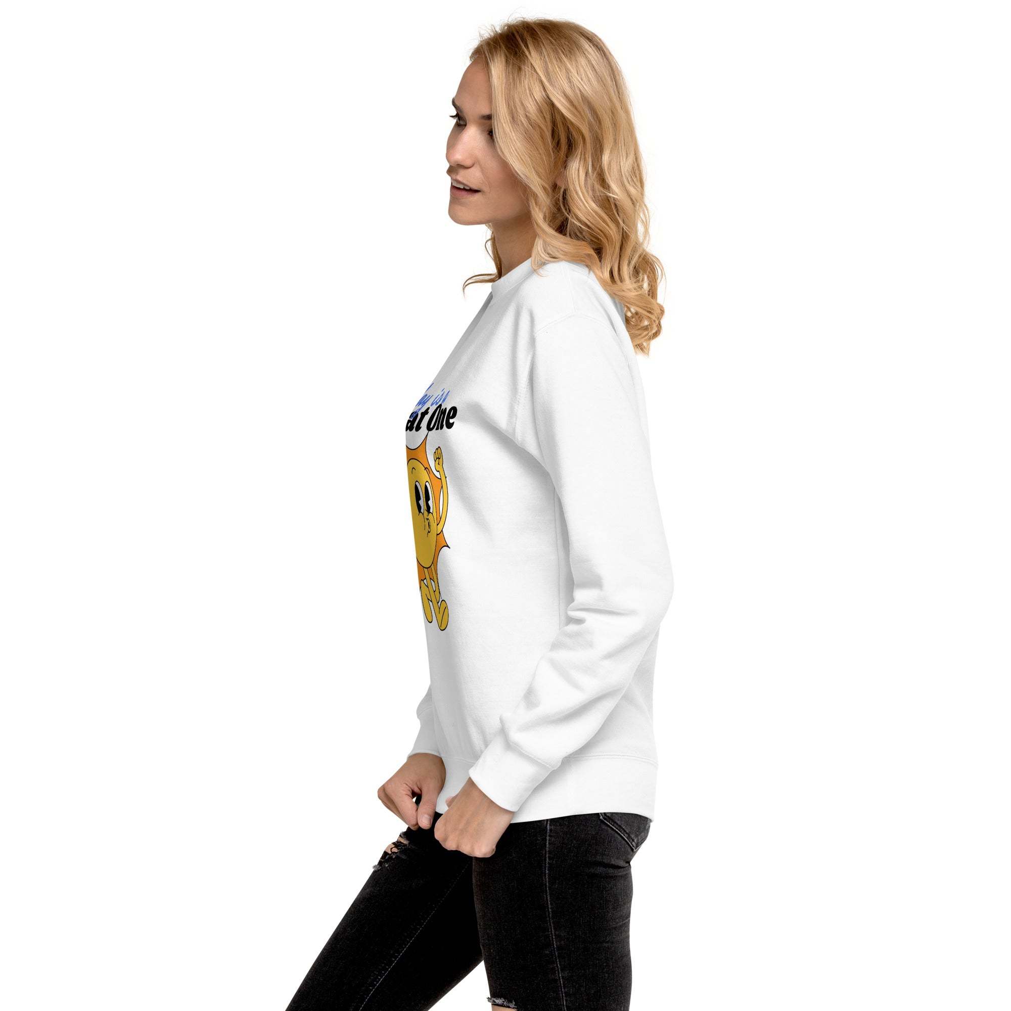 Woman wearing white Positive Sun Sweatshirt with cheerful sun graphic and motivational quote, side view