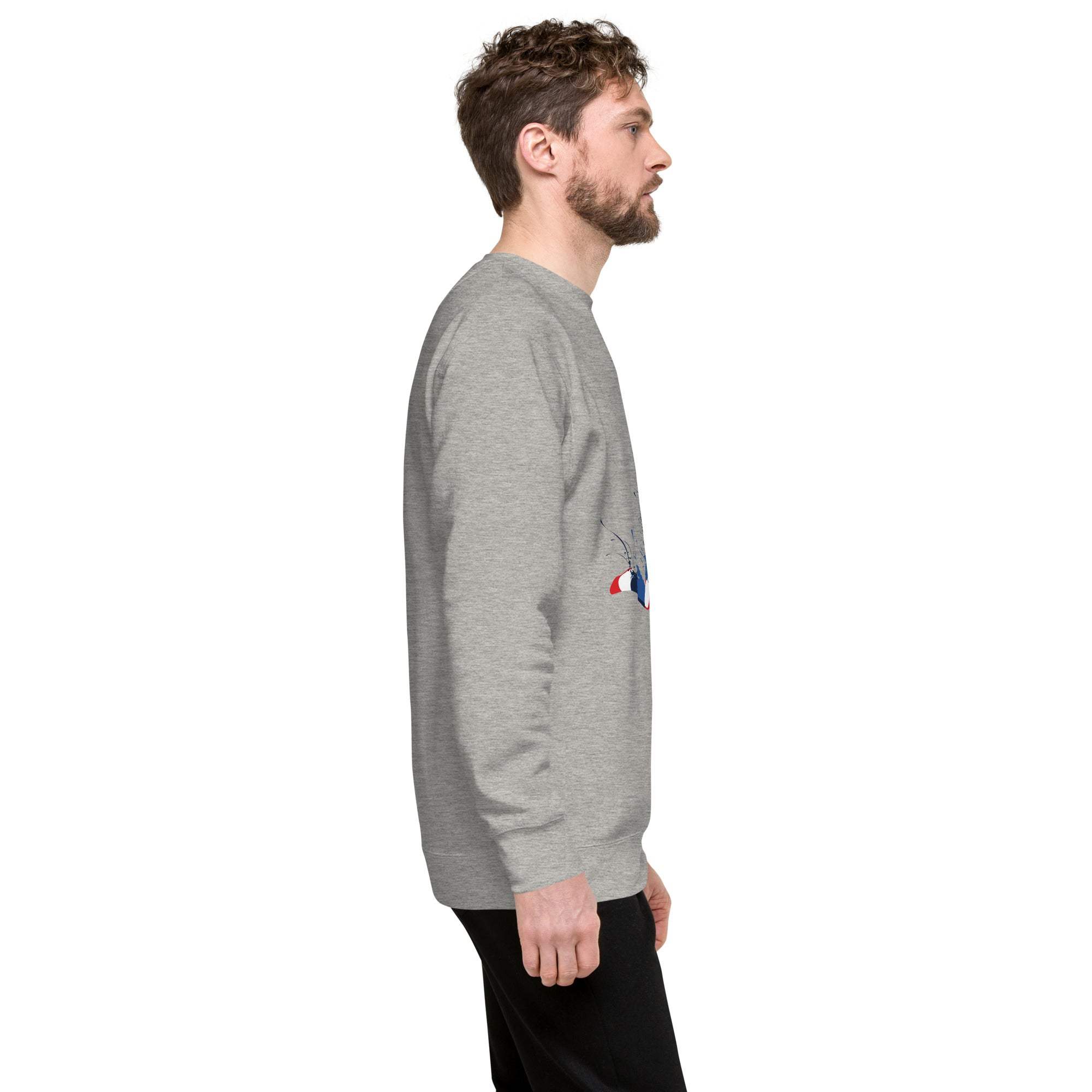 Side view of a man wearing a grey soccer player sweatshirt with a sports graphic design