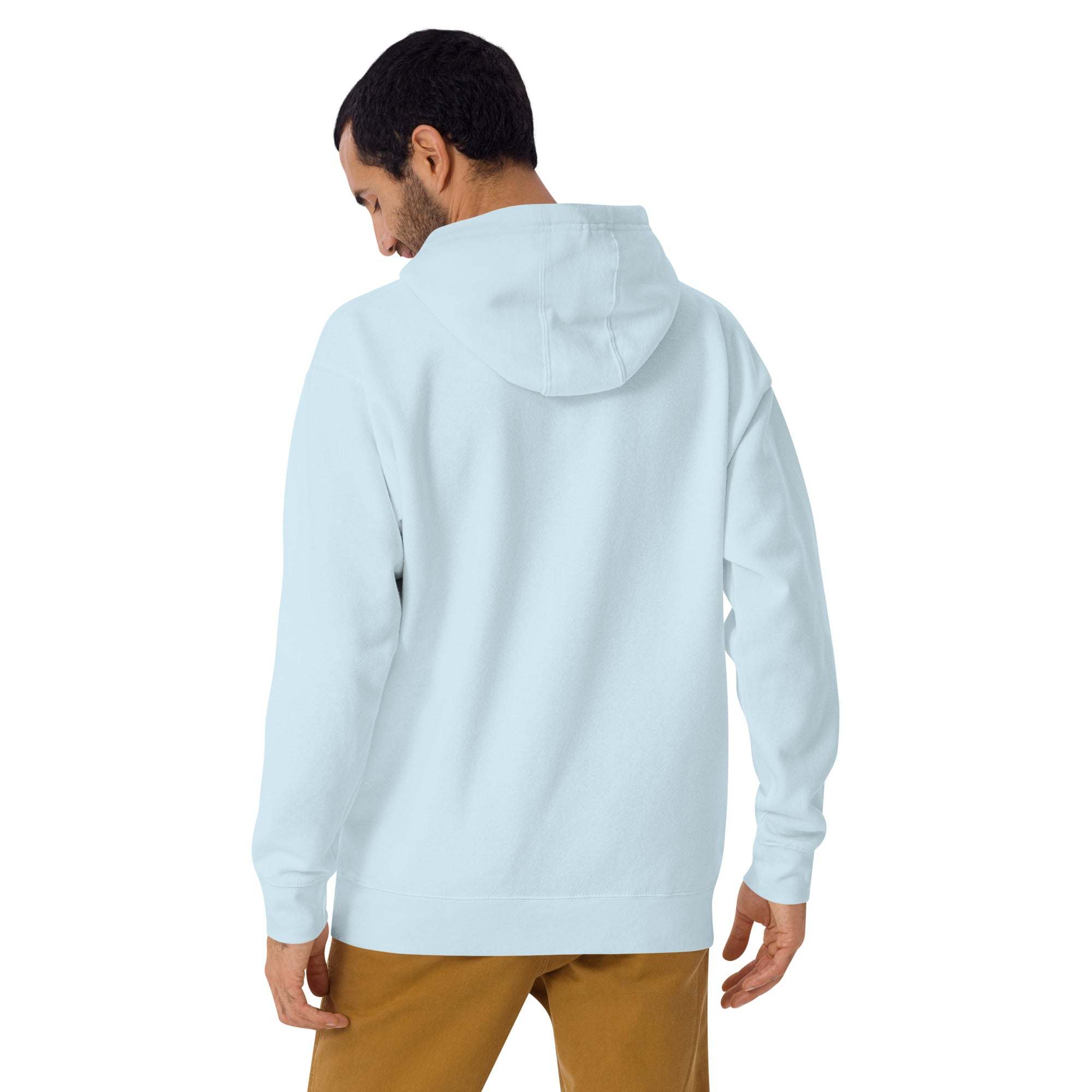 back view of a man wearing light blue American fashion hoodie with hood up and brown pants