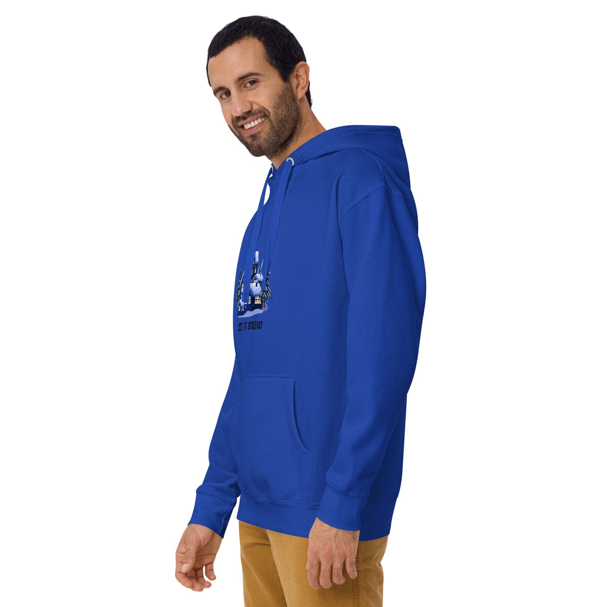 Man wearing blue Let It Snow Hoodie with snowy village design and front pocket