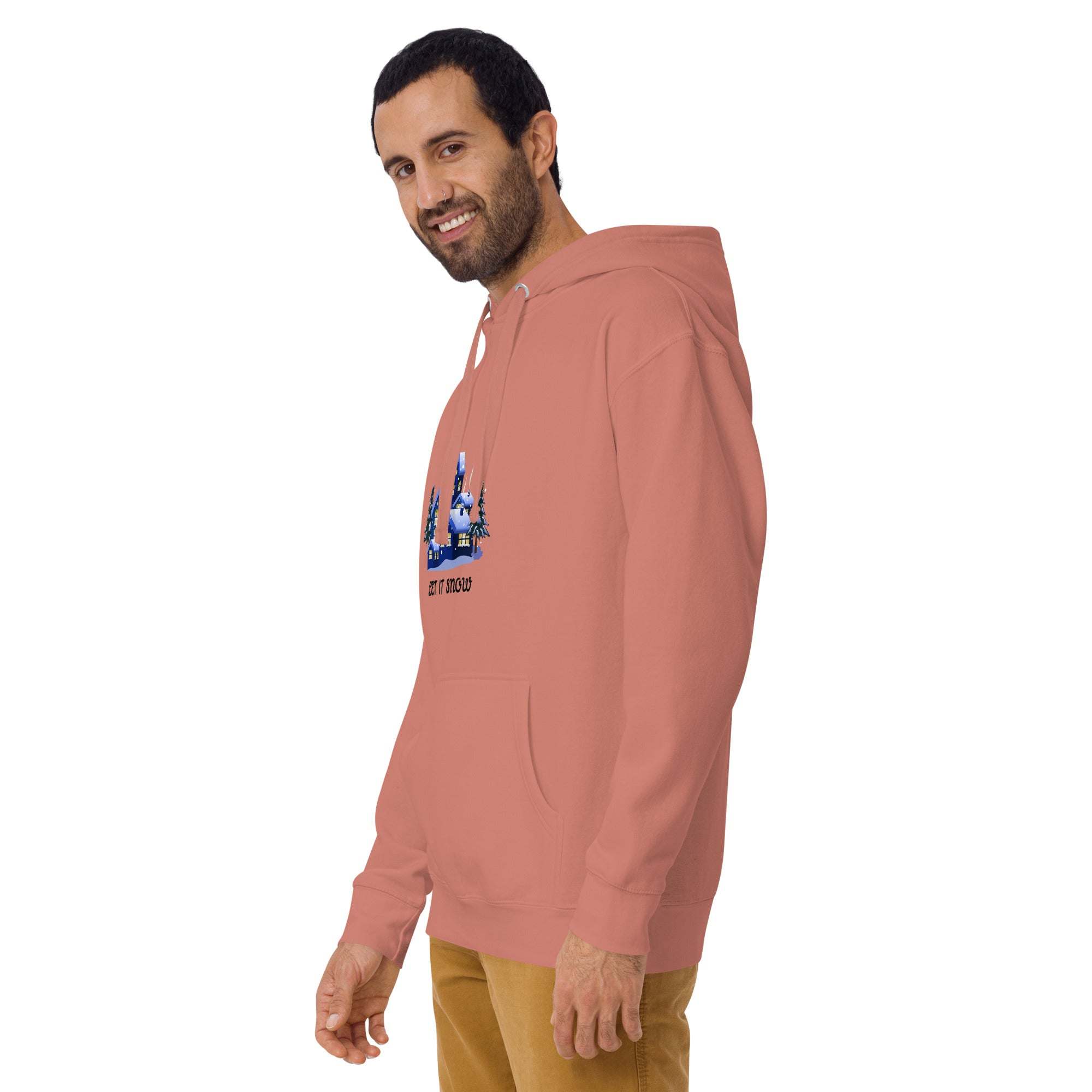 Man wearing peach Let It Snow Hoodie with snowy village design and front pocket