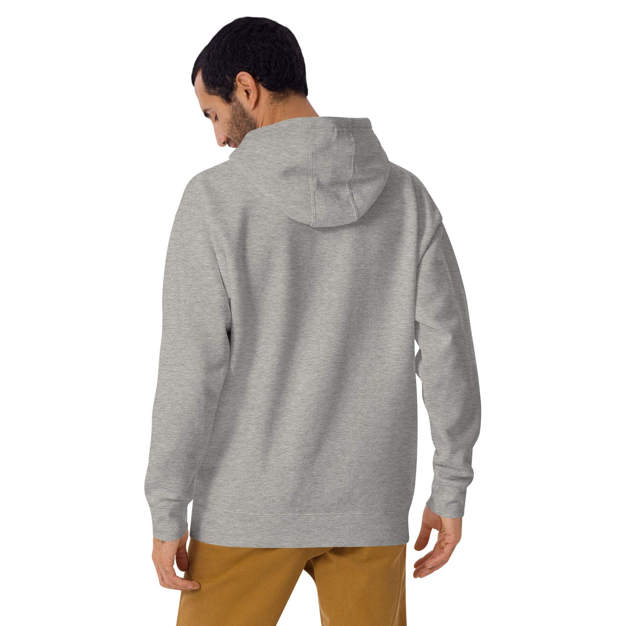 Back view of man wearing grey Let It Snow Hoodie with hood up and brown pants
