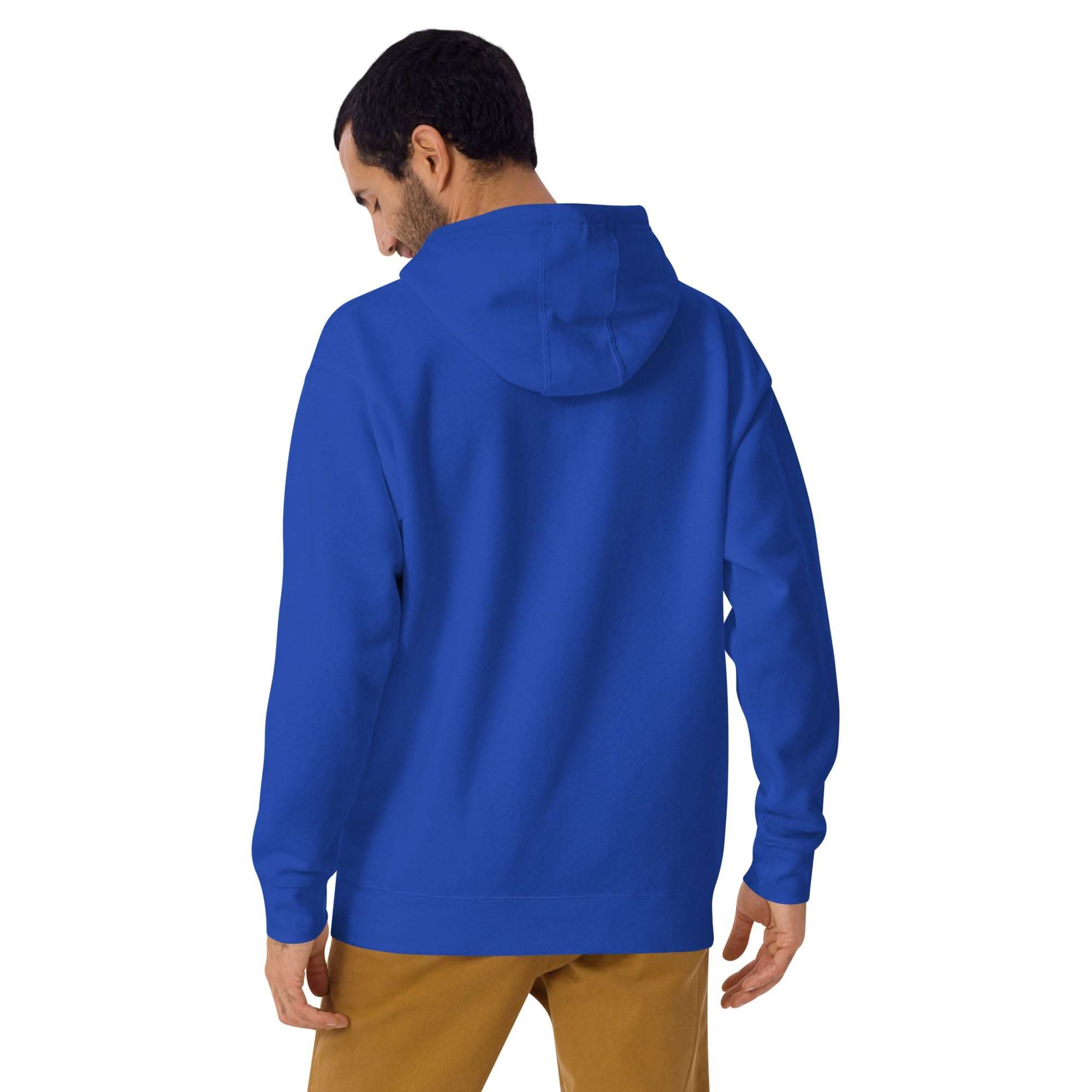 Back view of man wearing blue Lucky Clover Hoodie with hood up and brown pants