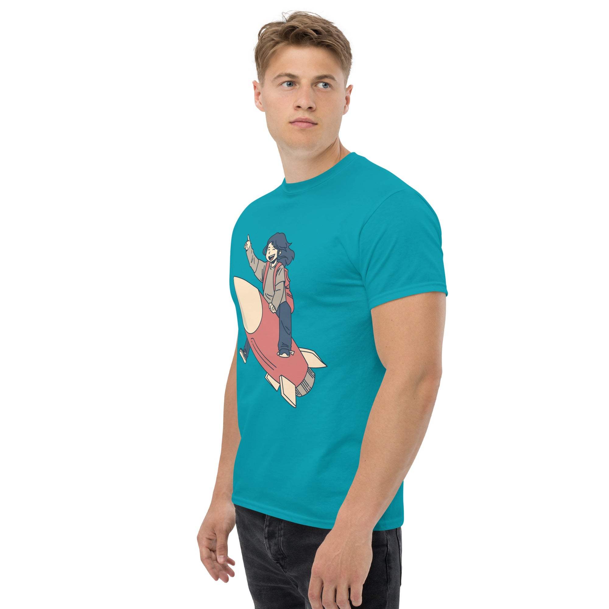 Man wearing turquoise Rocket Ride T-Shirt with retro cartoon rocket and astronaut graphic design