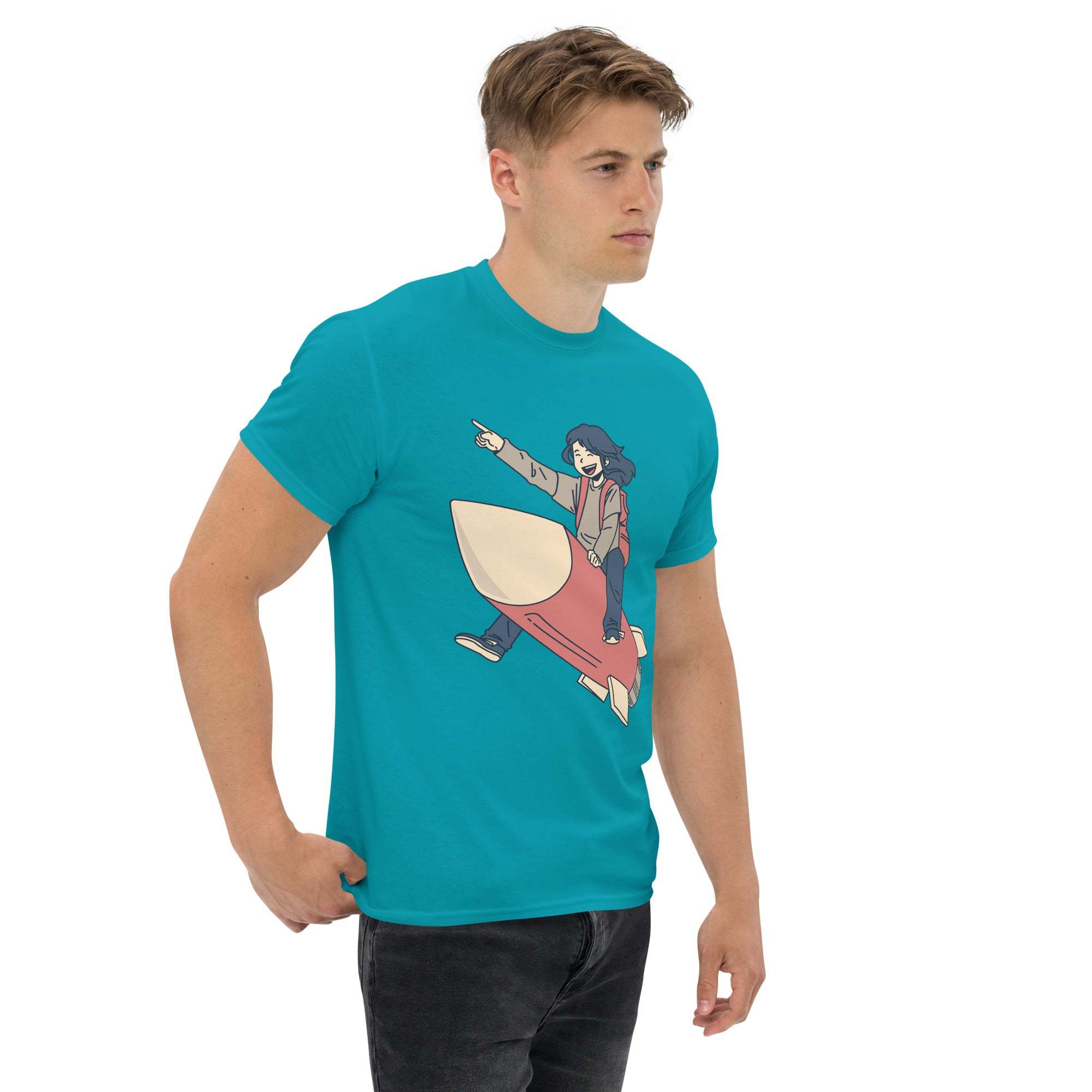 Man wearing turquoise Rocket Ride T-Shirt with retro cartoon space adventure graphic