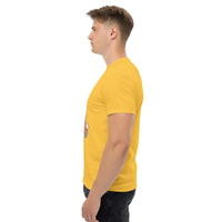 Side view of man wearing yellow Rocket Ride T-Shirt with retro space adventure graphic in unisex fit