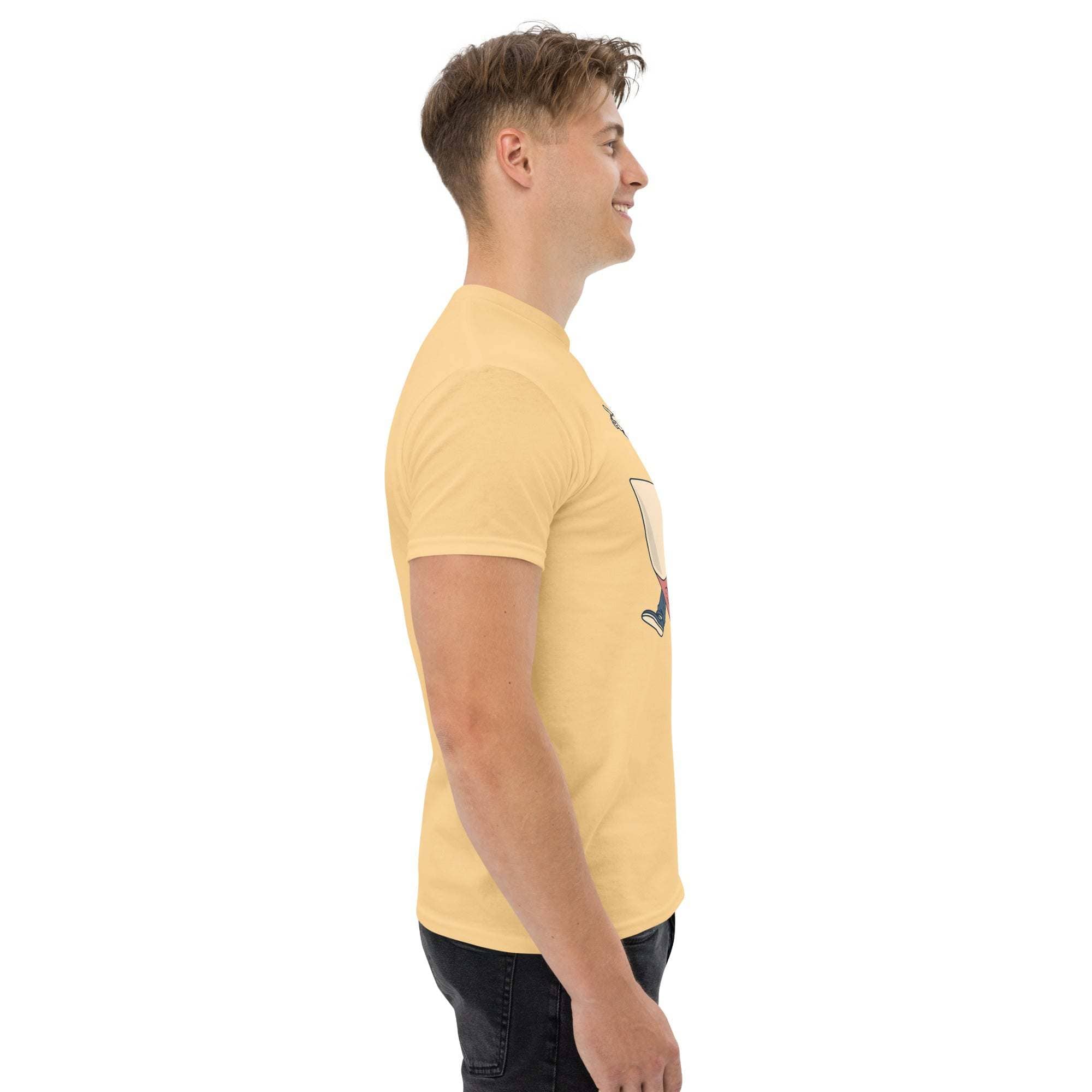 Man wearing yellow Rocket Ride T-Shirt with retro cartoon space adventure graphic side view