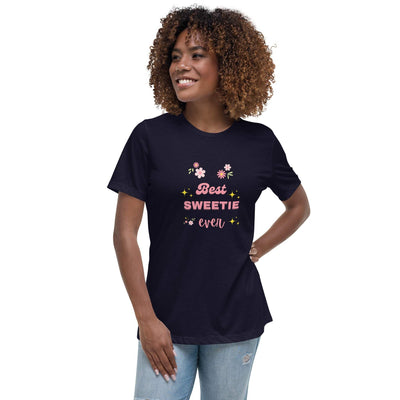 Woman wearing a navy blue "Best Sweetie Ever" t-shirt with floral and star designs, paired with light blue jeans